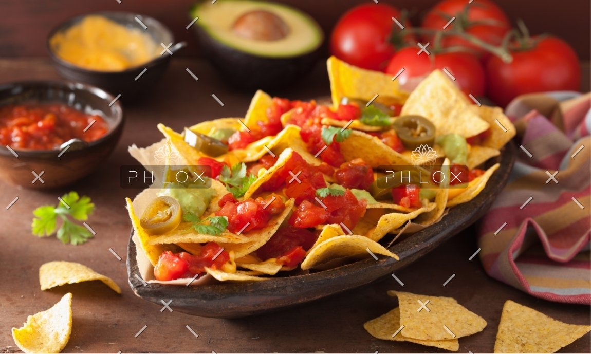 nachos-loaded-with-salsa-guacamole-cheese-and-P7GUFN7