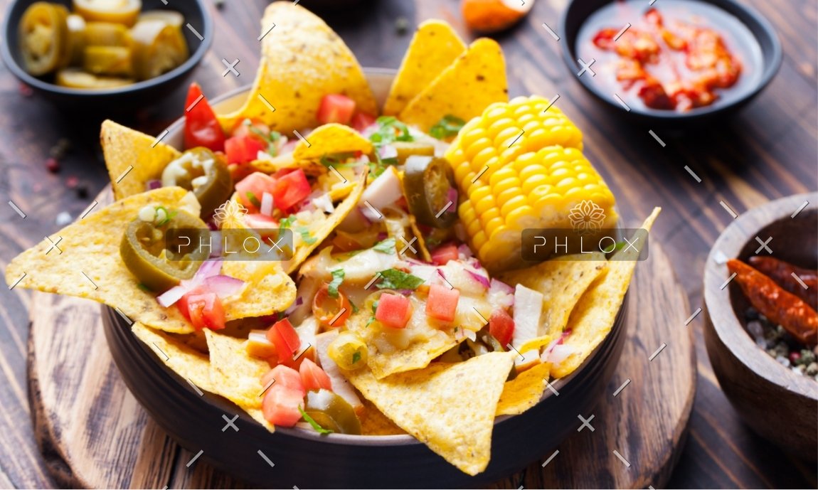 nachos-with-melted-cheese-sauce-salsa-corn-cobs-PMBWCHA