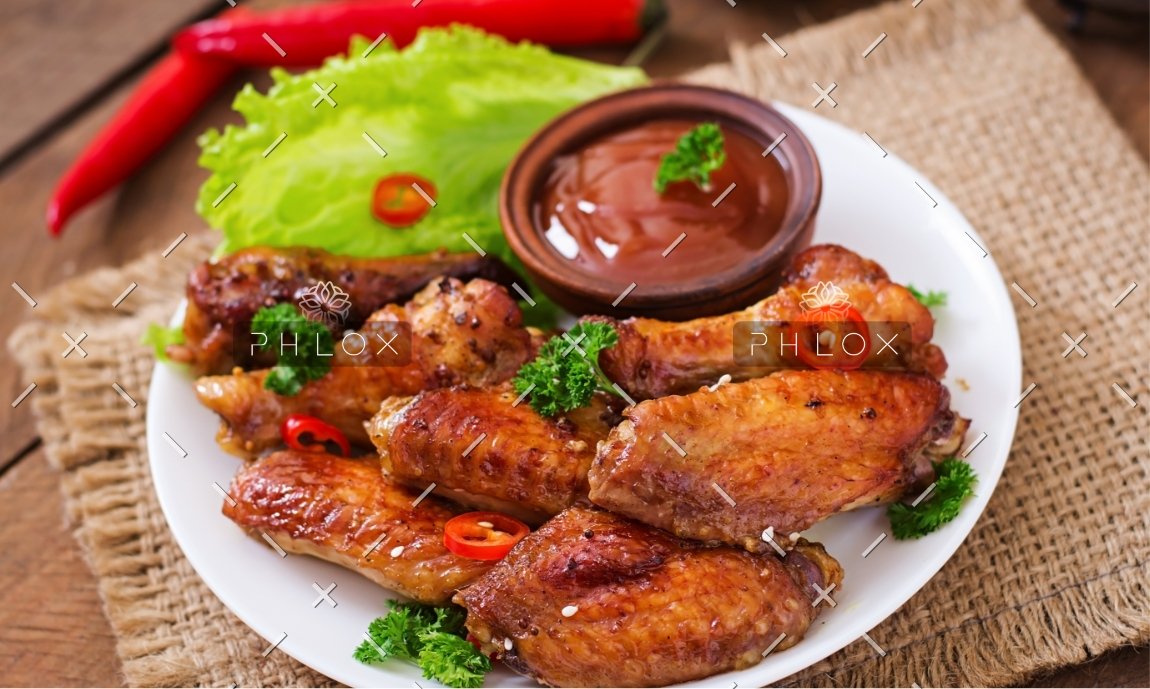 sour-sweet-baked-chicken-wings-and-sauce-PYAGX99